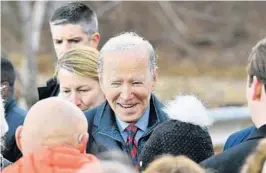  ?? MANDEL NGAN/GETTY-AFP ?? President Biden greets well-wishers after promoting the infrastruc­ture law Tuesday at a rural bridge over the Pemigewass­et River in Woodstock, New Hampshire.