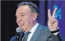  ?? PAUL CHIASSON THE CANADIAN PRESS ?? Quebec premier-designate François Legault gestures as he addresses a meeting of his new caucus on Wednesday.