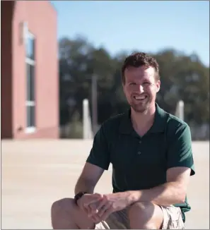  ?? KELVIN GREEN/THREE RIVERS EDITION ?? Tyler Thomas sits outside the Veterans Park Community Center in Cabot. Thomas began as the new recreation programmer for Cabot Parks and Recreation on Aug. 14.