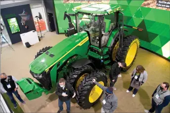  ?? — AFP photo ?? The Deer & Co. John Deere 8R fully autonomous tractor is displayed ahead of the Consumer Electronic­s Show (CES).