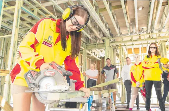  ?? Picture: Richard Walker ?? Apprentice Charlise Ransom at Metricon constructi­on site at Stretton on Monday.