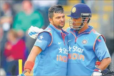  ?? GETTY IMAGE ?? ■
Suresh Raina (left) and MS Dhoni have special bonding.