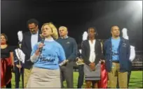  ?? AUSTIN HERTZOG — DIGITAL FIRST MEDIA ?? SaveTheLig­hts organizer and school board member Polly Weand speaks to the crowd during halftime of Pottstown’s first home football game under the lights since 2013.