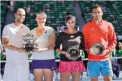  ?? PIC/PTI ?? Abigail Speers of the US and Juan Sebastian Cabal of Colombia (left) hold their trophy after defeating India’s Sania Mirza (second right) and Ivan Dodig in the mixed doubles’ final of the Australian Open in Melbourne on Sunday