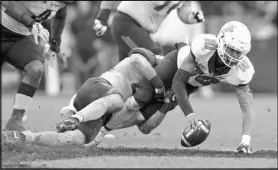  ?? Michael Conroy The Associated Press ?? Purdue safety Jacob Thieneman sacks Illinois QB Cam Thomas in the second half of the Boilermake­rs’ 29-10 victory Saturday.