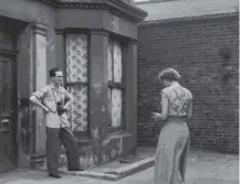  ?? ?? 0 US tourists at 10 Rillington Place, London, where John Christie killed seven women; he was arrested today in 1953
