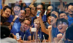  ?? Photograph: Toru Hanai/REUApple’s ?? Apple store staff pose with the new Apple iPhone 5S before its goes on sale at an Apple Store at Tokyo's Ginza shopping district September 20, 2013.