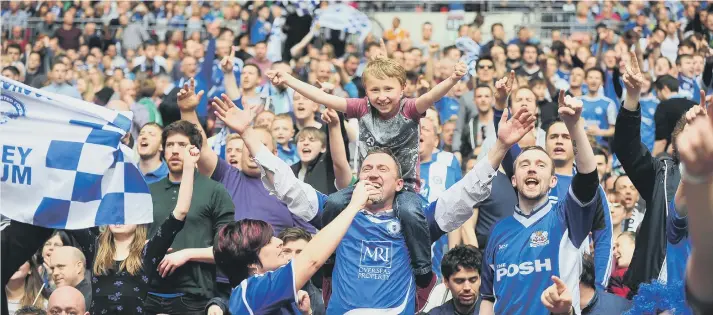  ??  ?? Posh fans at Wembley for the final of the Johnstone’s Paint Trophy in 2014.