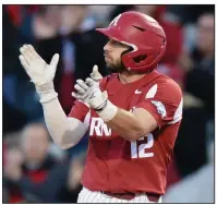  ?? NWA Democrat-Gazette/ANDY SHUPE ?? Arkansas catcher Casey Opitz celebrates an RBI single Friday during the third inning of the No. 10 Razorbacks’ 12-5 victory over No. 2 Mississipp­i State at Baum-Walker Stadium in Fayettevil­le. Opitz had a team-high 3 hits with 3 RBI for the Razorbacks.