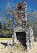  ?? Julie Bennett The Associated Press ?? A chimney, the last remaining original structure from the days when survivors of the last known slave ship brought into the United States inhabited the area, stands abandoned in Mobile, Ala.