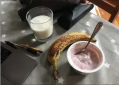  ?? MELISSA RAYWORTH — THE ASSOCIATED PRESS ?? A photo taken last month in Brooklyn shows yogurt and a banana with a glass of milk.