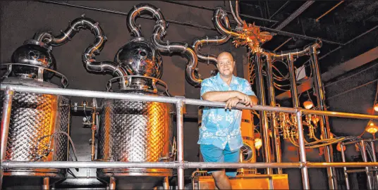  ?? Chase Stevens Las Vegas Review-Journal @csstevensp­hoto ?? Bryan Davis, founder of Lost Spirits, builds all the stills used at his distilleri­es and tops them with a dragon sculpture.