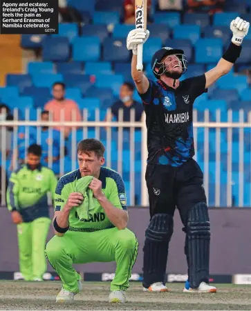  ?? GETTY ?? Agony and ecstasy: Ireland’s Craig Young feels the pain as Gerhard Erasmus of Namibia celebrates