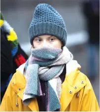  ?? (Reuters) ?? GRETA THUNBERG attends a climate strike in Stockholm earlier this month.