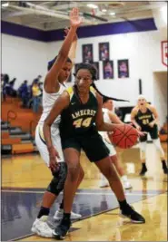  ?? RANDY MEYERS — THE MORNING JOURNAL ?? Amherst center Amaya Staton posts up against Amari Davidson of Avon during the first quarter of their game on Jan. 17.