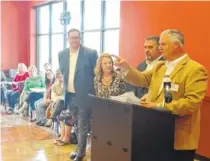  ?? STAFF PHOTO BY MIKE PARE ?? Food City officials passed out more than $93,000 in School Bucks Program checks to Chattanoog­a area schools Monday. From left are Gladden Middle School Principal Phillip Greeson, school Executive Assistant Darlene Lance, Food City Dalton, Ga., Store...