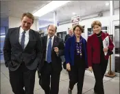  ?? J. SCOTT APPLEWHITE / ASSOCIATED PRESS ?? Sens. Jeff Flake (from left), R-Ariz., Chris Coons, D-Del., Amy Klobuchar, D-Minn., and Jeanne Shaheen, D-N.H., arrive at the Capitol after a bipartisan group of moderate senators held a private meeting Sunday.