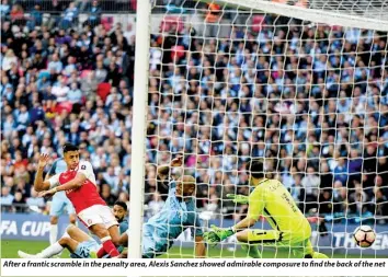  ??  ?? After a frantic scramble in the penalty area, Alexis Sanchez showed admirable composure to find the back of the net