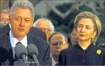  ??  ?? Bill and Hillary Clinton at a rally after the US President was impeached on December 9, 1998 over the Clinton-lewinsky scandal