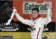  ?? TERRY RENNA — ASSOCIATED PRESS ?? Denny Hamlin celebrates in Victory Lane after winning the Monster Energy Cup race on Sept. 3 at Darlington Raceway.