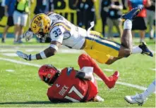  ?? ASSOCIATED PRESS FILE PHOTO ?? Louisville wide receiver James Quick is stopped by LSU safety Jamal Adams after a reception during the first half of the 2016 Citrus Bowl in Orlando, Fla. Adams is expected to be one of the top selections in the NFL draft.