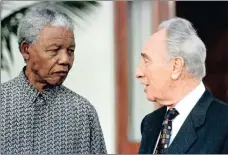  ?? FILE PHOTO: REUTERS ?? President Nelson Mandela exchanges views with former Israeli prime minister Shimon Peres on October 20, 1996. During his tenure as president, Mandela set numerous landmark precedents, respecting and complying with the rule of law.