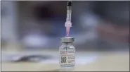  ?? BRENT LEWIN — BLOOMBERG FILE ?? A vial of the Moderna COVID-19 vaccine at a pharmacy in Sydney, Australia, on Dec. 29.