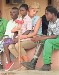  ?? ASSOCIATED PRESS ?? Britain’s Diana, Princess of Wales, talks to amputees at the Neves Bendinha Orthopedic Workshop in the outskirts of Luanda, Angola, in 1997. It has been 20 years since her death in a car crash in Paris, but her influence has endured.