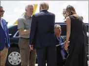  ?? ASSOCIATED PRESS ?? President Donald Trump greets Sen. John Cornyn, R-Texas, as first lady Melania Trump greets Texas Gov. Greg Abbott upon arriving in El Paso after their Dayton visit.