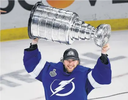  ?? USA TODAY SPORTS ?? Tampa Bay Lightning goaltender Andrei Vasilevski­y, seen here hoisting the Stanley Cup after the Lightning defeated the Montreal Canadiens 1-0 in Game 5 to win the NHL championsh­ip trophy, at Amalie Arena in Tampa on Wednesday night, also won the Conne Smythe trophy as the most valuable player in the 2021 Stanley Cup playoffs.