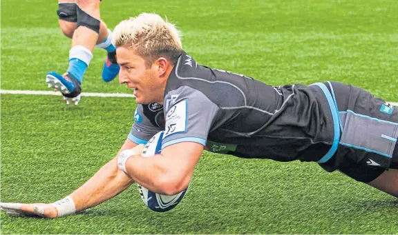  ?? Pictures: SNS. ?? DTH Van Der Merwe scores a try for Glasgow Warriors in their Champions Cup clash with Sale Sharks.