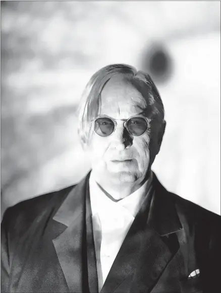  ?? Photograph­s by Josh Cheuse ?? T BONE BURNETT’S lyrics on his “Infinite Light” album sound a warning of looming dangers and offer possible responses to them.