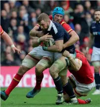  ?? AP ?? Scotland’s John Barclay is tackled during the Six Nations rugby match against Wales. —