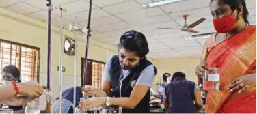  ?? Agence France-presse ?? ↑
Students undergo Class 12 practical board examinatio­ns at a school in Chennai on Friday.