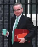  ??  ?? Michael Gove with a reusable cup Photograph: Leon Neal/Getty Images