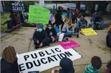  ?? ANDACHU— STAFF ARCHIVES ?? Parents and students gather for a quiet protest of continued school closures on Jan. 13 at Berkeley’s Thousand Oaks Elementary School.