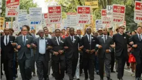  ?? David Lee/Netflix ?? Michael Potts, left, as Cleveland Robinson, Aml Ameen as Martin Luther King Jr., Chris Rock as Roy Wilkins and Glynn Turman as A. Philip Randolph in “Rustin.”