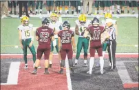  ?? Contribute­d photo ?? Holy Cross and Torrington line up for the coin toss prior to an NVL football game on Nov. 1, 2018.