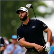  ?? AP PHOTO BY JULIO CORTEZ ?? Jon Rahm, of Spain, watches his shot on the 15th hole during the first round of the U.S. Open golf tournament at The Country Club, Thursday, June 16, 2022, in Brookline, Mass.