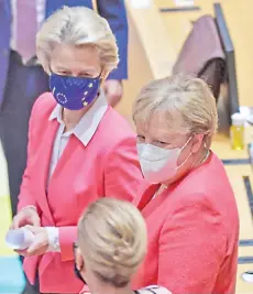  ?? — AFP photo ?? Merkel (right) speaks with Ursula (top) and Denmark’s Prime Minister Mette Frederikse­n (front) as they arrive for a roundtable meeting on the second day of a European Union (EU) summit at The European Council Building in Brussels.