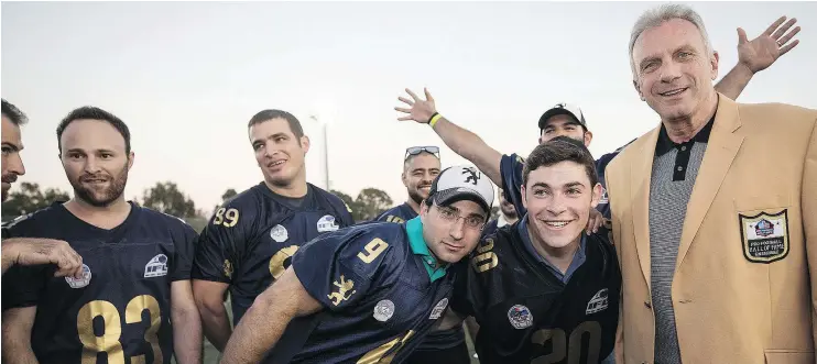  ?? — THE ASSOCIATED PRESS ?? Joe Montana meets with Israeli football players near Tel Aviv. Eighteen NFL Hall of Famers are in the Holy Land to help develop the sport.