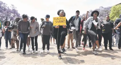  ?? Picture: Neil McCartney ?? FLASHBACK. A group of concerned staff and academics protesting on the steps of the Great Hall at Wits in October last year at the height of the #FeesMustFa­ll protests.