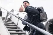  ??  ?? THUMB PLAYER Kyle Walker boards the plane to Russia