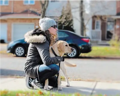  ??  ?? Danika Blackstock and her new guide dog, Ulysses, provided to her by the Canadian Institute for the Blind.