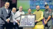  ?? PTI PHOTO ?? Human resource developmen­t minister Prakash Javadekar presents a portrait of Param Vir Chakra awardees to JNU ProVC Chintamani Mahapatra at the launch of the Vidya, Veerta Abhiyaan in New Delhi on Tuesday.