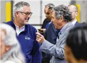  ?? ?? Butler Tech Superinten­dent and CEO Jon Graft (left) talks to Sen. Sherrod Brown, D-Ohio, before President Joe Biden speaks Friday at United Performanc­e Metals in Hamilton.