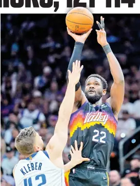  ?? AP PHOTO ?? MAVERICKS VS SUNS. Phoenix Suns center Deandre Ayton (22) shoots over Dallas Mavericks forward Maxi Kleber (42) during the second half of Game 1 in the second round of the NBA Western Conference playoff series Monday, May 2, 2022, in Phoenix.