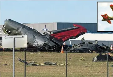  ?? —AP ?? Disaster in the sky: Debris from the crash scattered on a field at Dallas Executive Airport. (Inset) This Boeing B-17 Flying Fortress collided with a smaller Bell P-63 Kingcobra.