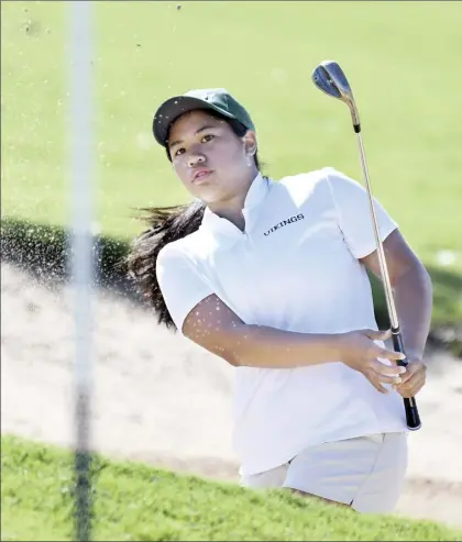  ??  ?? PHOTO ABOVE:
Portland State University’s Jasmine Cabajar, a Maui High
School graduate, blasts out of a sand trap on the Royal Kaanapali Golf Course’s second hole during the first round of the Anuenue Spring Break Classic on Monday.