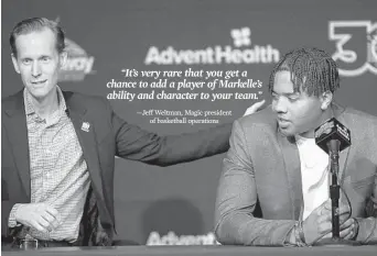  ?? RICARDO RAMIREZ BUXEDA/ORLANDO SENTINEL ?? Magic president of basketball operations Jeff Weltman, left, introduces Markelle Fultz at Thursday’s news conference.